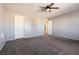 Large bedroom with grey and white walls, carpet flooring at 9032 Mackanos Ave, Las Vegas, NV 89148