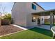 House exterior showcasing a side view with a patio and backyard at 9032 Mackanos Ave, Las Vegas, NV 89148