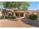 Exterior view of home with covered patio and landscaping at 9621 Blue Bell Dr, Las Vegas, NV 89134