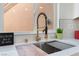 Modern kitchen sink with gold faucet and stylish backsplash at 9621 Blue Bell Dr, Las Vegas, NV 89134