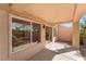 Covered patio with sliding glass doors and exterior lighting at 9621 Blue Bell Dr, Las Vegas, NV 89134