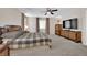 Spacious main bedroom with king bed, large TV and ample closet space at 9665 Powell River Dr, Las Vegas, NV 89148