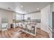 Modern kitchen with white cabinets, granite countertops and an island at 10439 Prairie Mountain Ave, Las Vegas, NV 89166