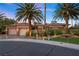 Beautiful desert home with palm trees and landscaping at 10638 Mandarino Ave, Las Vegas, NV 89135