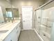 Modern bathroom with double vanity and glass shower at 11236 Rainbow Peak Ave # 210, Las Vegas, NV 89135