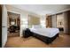 Spacious bedroom with king-size bed and ensuite bathroom access at 145 Harmon Ave # 208, Las Vegas, NV 89109