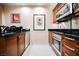 Modern kitchen with stainless steel appliances and wood cabinetry at 145 Harmon Ave # 208, Las Vegas, NV 89109