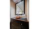 Dark wood vanity with a large mirror and vessel sink at 145 Harmon Ave # 208, Las Vegas, NV 89109