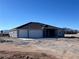 Single-story home with three-car garage and mountain views at 1761 Moose St, Pahrump, NV 89048