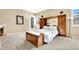 Large main bedroom with built-in wooden cabinetry and fireplace at 2110 Mooreview St, Henderson, NV 89012