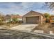 Single-story house with a two-car garage and nicely landscaped yard at 2420 Ailsa Craig St, Henderson, NV 89044