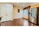 Bright kitchen features stainless steel refrigerator and dark wood floors at 2420 Ailsa Craig St, Henderson, NV 89044