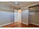 Bedroom with wood floors, closet, and door to hallway at 3200 E Owens Ave, North Las Vegas, NV 89030