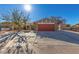 Single story home with attached garage and desert landscaping at 331 Lime Cir, Henderson, NV 89015