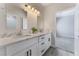 Bathroom with double vanity, quartz countertop, and mirrors at 3920 Syracuse Dr, Las Vegas, NV 89121