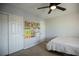 Bright bedroom with double bed, ceiling fan, and ample closet space at 434 Fortissimo St, Henderson, NV 89011