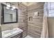 Modern bathroom with a walk-in shower and updated vanity at 4813 W Richmar Ave, Las Vegas, NV 89139