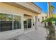 Private back patio with sliding glass doors and landscaping at 7844 Bluewater Dr, Las Vegas, NV 89128