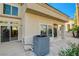 Back patio with AC unit and sliding glass doors at 7844 Bluewater Dr, Las Vegas, NV 89128