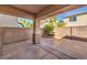 Covered patio and spacious backyard with block wall at 8320 S Pioneer Way, Las Vegas, NV 89113