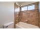 Bathroom with shower/tub combo and tile surround at 8320 S Pioneer Way, Las Vegas, NV 89113