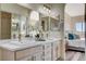 Elegant bathroom with double vanity and marble countertops at 9309 Deer Lodge Ln, Las Vegas, NV 89129