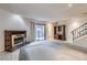 Spacious living room featuring a brick fireplace and sliding glass doors at 5476 S Maryland Pkwy, Las Vegas, NV 89119