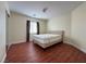 Bright bedroom featuring a comfortable bed and wood floors at 1596 Little Crow Ave, Las Vegas, NV 89123