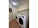 Laundry room with washer, dryer, and utility sink at 1596 Little Crow Ave, Las Vegas, NV 89123