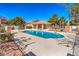 Community pool with shaded seating and surrounding landscaping at 2813 Prickley Pear Dr, Henderson, NV 89074