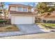 Two-story house with a white garage door and landscaped yard at 2813 Prickley Pear Dr, Henderson, NV 89074