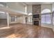 Bright living room with vaulted ceilings, stone fireplace, and hardwood floors at 2813 Prickley Pear Dr, Henderson, NV 89074