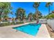 Sparkling community pool with palm trees at 2813 Prickley Pear Dr, Henderson, NV 89074