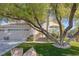 Two-story home with mature landscaping and large tree at 3974 Tropical Vine St, Las Vegas, NV 89147