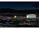 Night aerial view of the Las Vegas Strip, showcasing city lights and mountains in the distance at 4471 Dean Martin Dr # 3000, Las Vegas, NV 89103