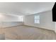 Spacious loft area with neutral carpeting and large window at 4531 Pencester St, Las Vegas, NV 89115