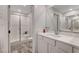 Clean bathroom with walk-in shower and updated vanity at 6176 Rathbone St, Las Vegas, NV 89166