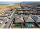 Aerial view of house and neighborhood, showcasing the pool and backyard at 10973 Dixie Johnson Ave, Las Vegas, NV 89166