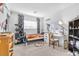 Bedroom with cat tree, desk, and shelving at 1129 Majestic Canyon St, Henderson, NV 89052