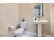 Clean and bright bathroom with pedestal sink and neutral tones at 1189 Hillside Peak St, Henderson, NV 89002