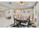 Elegant dining room featuring a large table and access to hallway at 1189 Hillside Peak St, Henderson, NV 89002