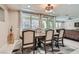 Bright dining room with a wooden table and access to the backyard at 1189 Hillside Peak St, Henderson, NV 89002