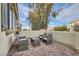 Small patio with wicker furniture, perfect for relaxing outdoors at 1189 Hillside Peak St, Henderson, NV 89002