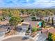 Aerial view of house, pool, and surrounding neighborhood with mountain backdrop at 2244 Windsor Dr, Henderson, NV 89014