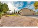 House exterior showcasing a large side yard and driveway at 2244 Windsor Dr, Henderson, NV 89014