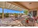 Back patio with seating area, grill, and views of the surrounding hills at 2409 Anderson Park Dr, Henderson, NV 89044