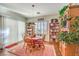 Bright breakfast nook with ample natural light, bookshelves, and a dining table at 2409 Anderson Park Dr, Henderson, NV 89044