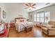 Large main bedroom with ceiling fan, wooden furniture, and plush carpet at 2409 Anderson Park Dr, Henderson, NV 89044