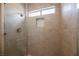 Clean shower with beige tile and glass enclosure at 3105 Birdwood Dr, Las Vegas, NV 89134