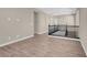 Upper hallway with wood-look floors and black railing at 3409 Iron Hagen Ct, Las Vegas, NV 89141